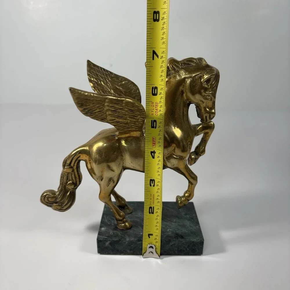 vintage solid brass Pegasus figurine mounted on a green marble base,